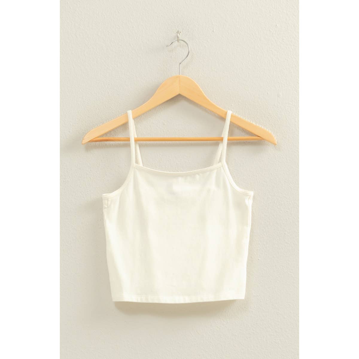 
Basic cami crop top with fitted design and classic straps, ideal for layering or everyday minimalist styling