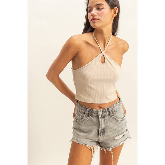 Fashionable halter cutout crop top with fitted design and bold neckline, ideal for statement summer or evening looks
