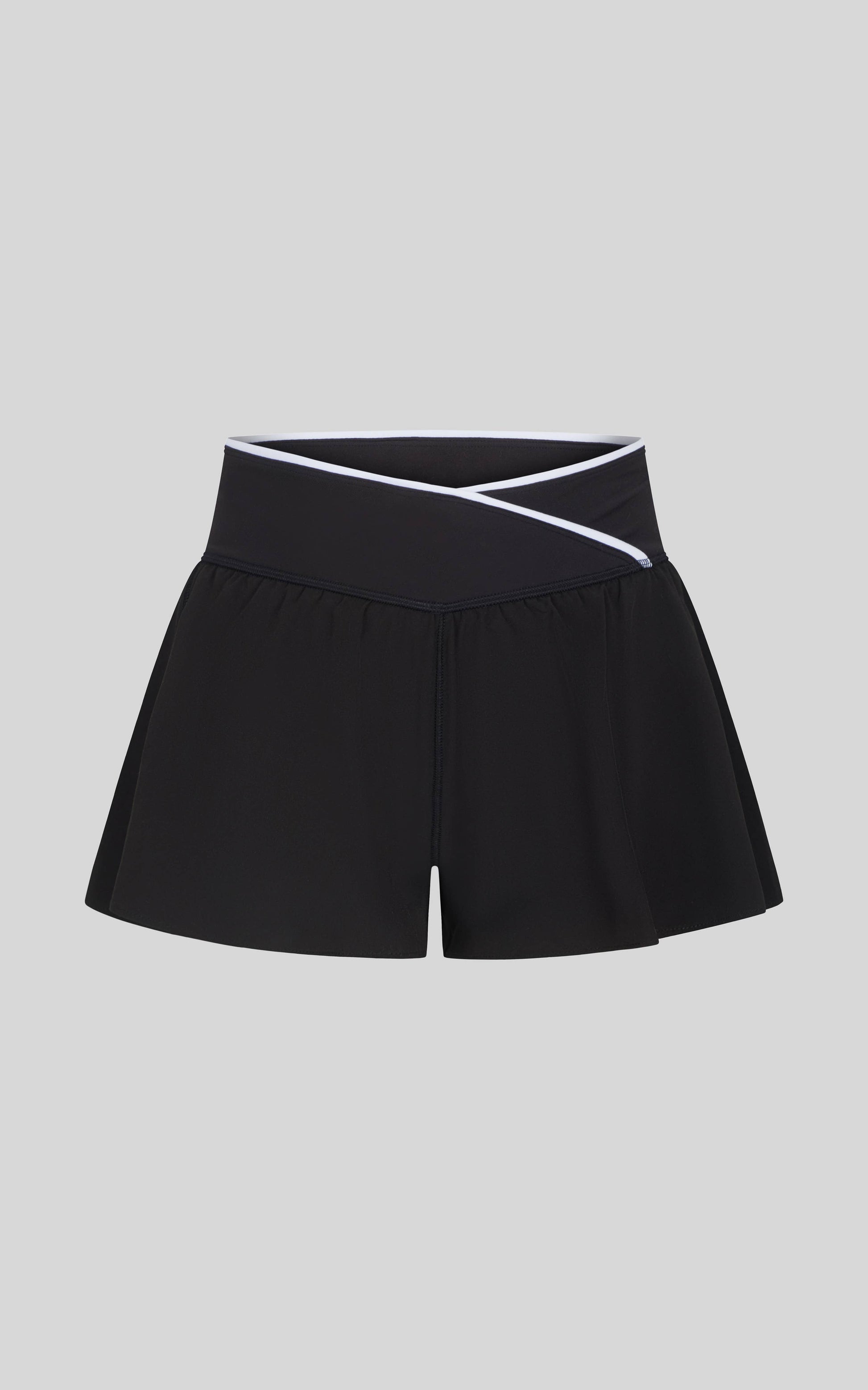 Girls light performance shorts with criss-cross waistband, ideal for active or casual everyday wear