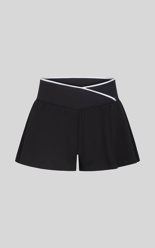 Girls light performance shorts with criss-cross waistband, ideal for active or casual everyday wear